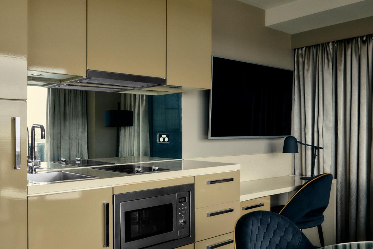 The Kinson Hotel Melbourne Kültér fotó A kitchen in a serviced apartment