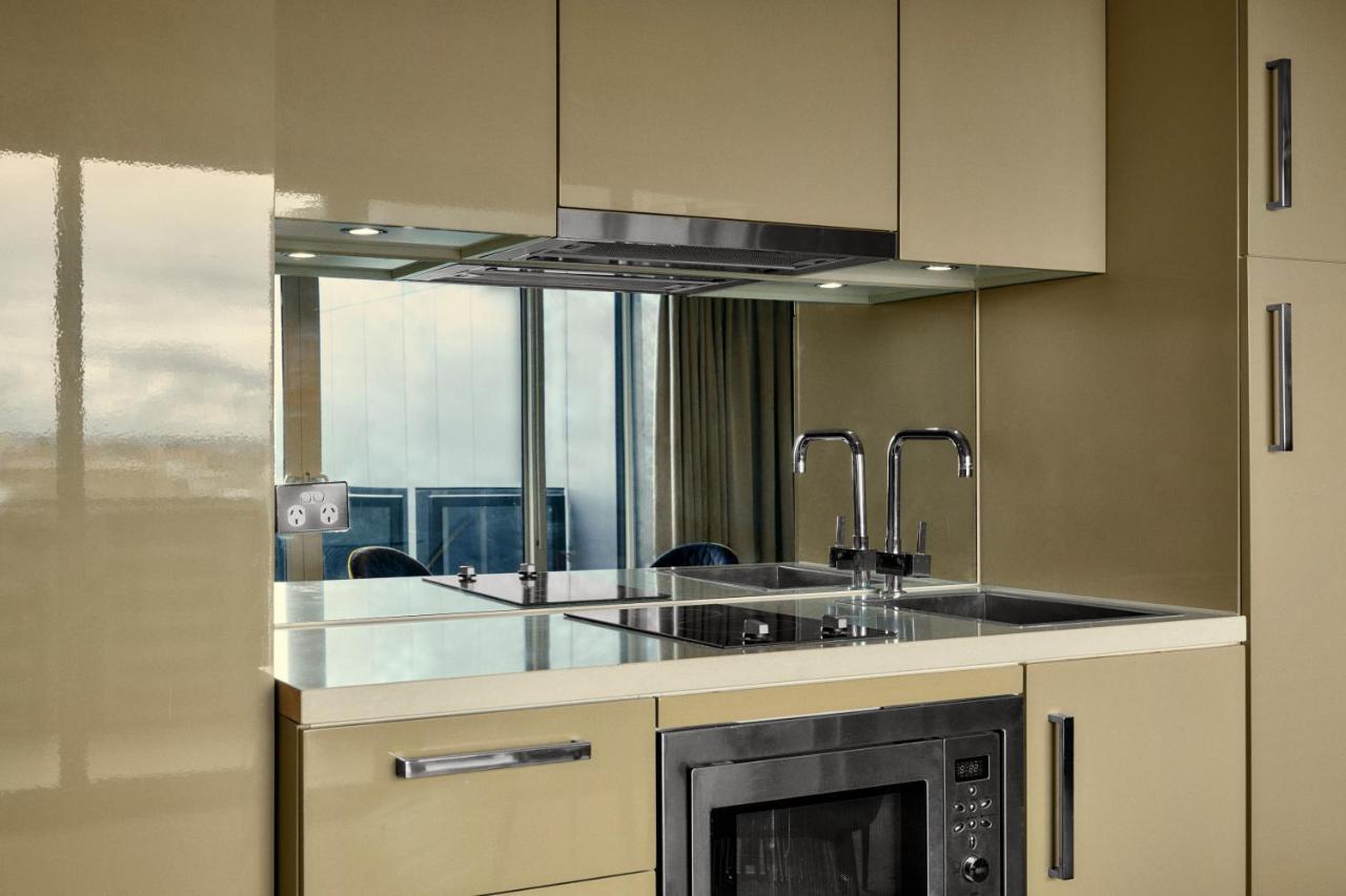 The Kinson Hotel Melbourne Kültér fotó A kitchen with a built-in microwave oven